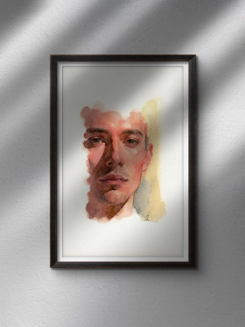Framed watercolor painting of a man in sunlight with brown hair, white shirt, and yellow-red brushstroke background.