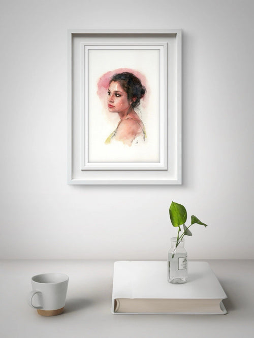Framed 5.5x8.5 watercolor-style portrait of a woman in a pink-toned dress against a plain white background.