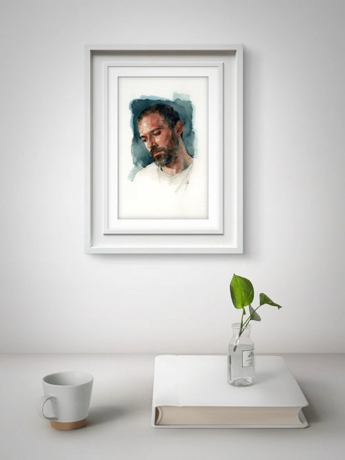White-framed watercolor painting of a man in a white shirt, blue pants, standing before a vase of green leaves.