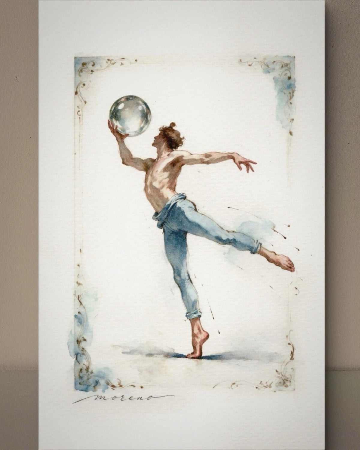 Male dancer in light blue pants and shoes holding silver glass sphere, with ornate border and “Moreau” text in lower right.
