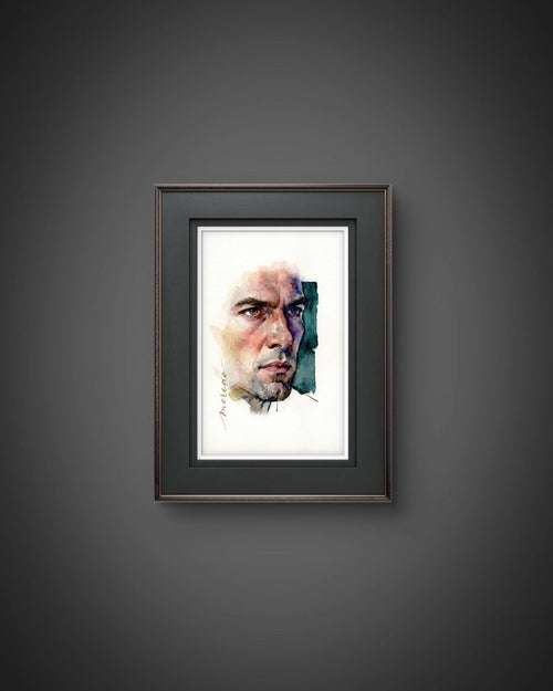 Black-framed watercolor painting of a seated male figure with long hair, set against a dark background.